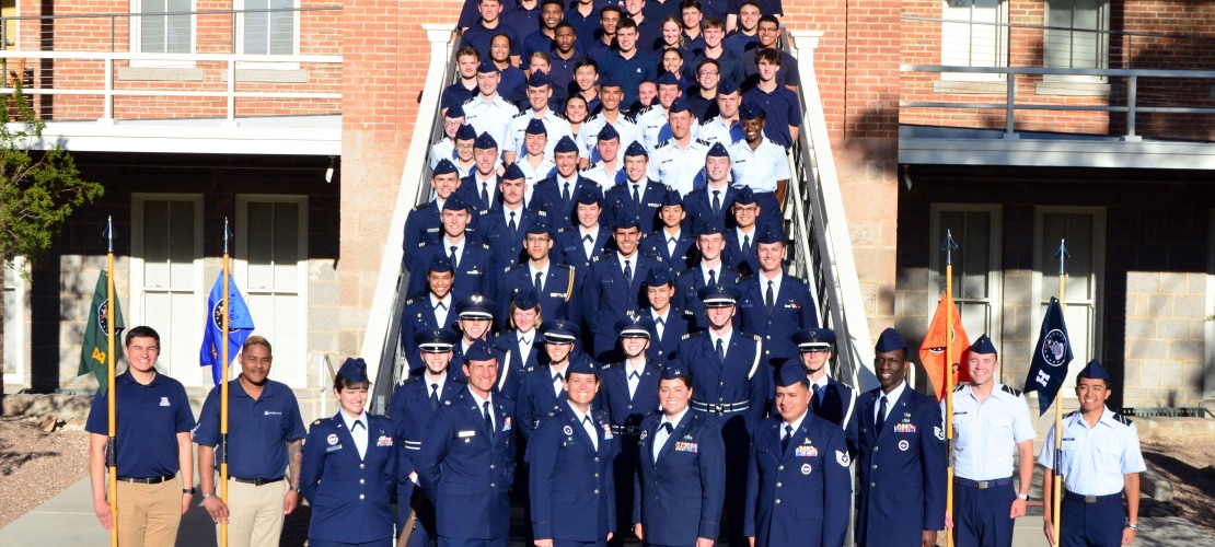Photo of cadet and staff in front of Old Main. 
